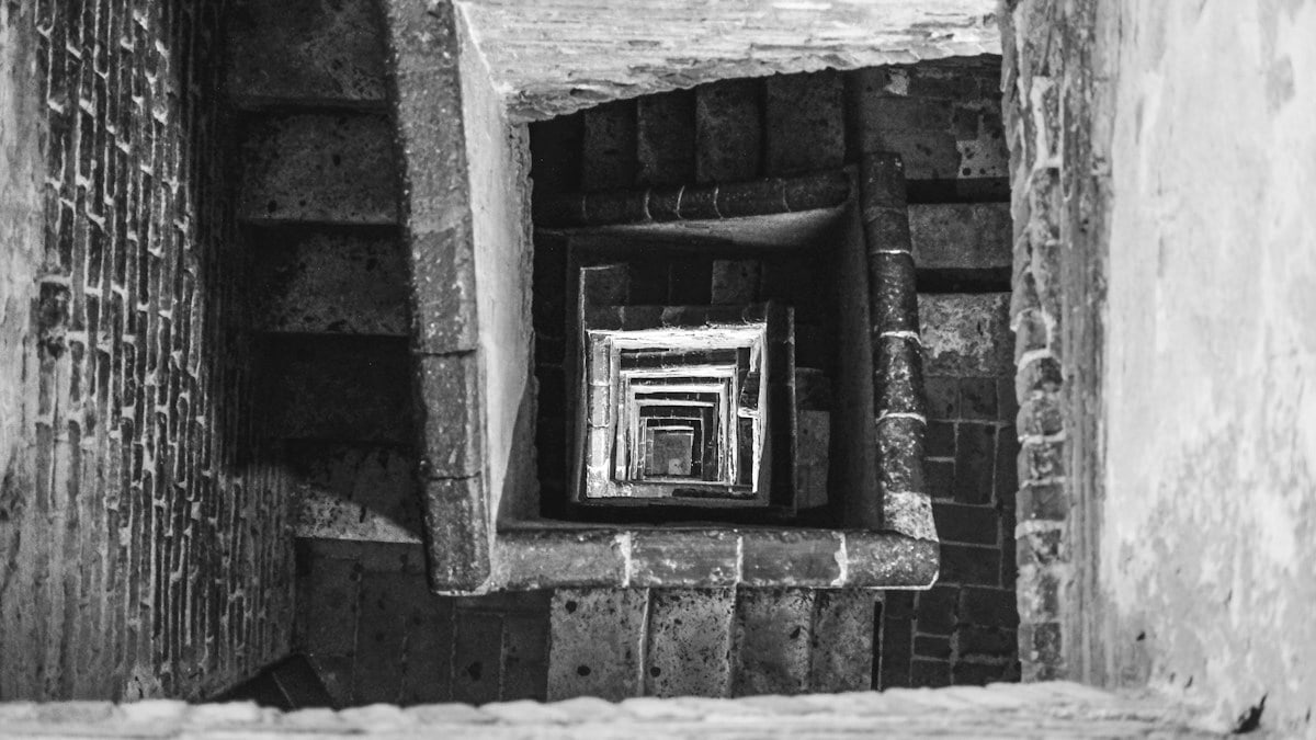 grayscale photography of concrete stairs
